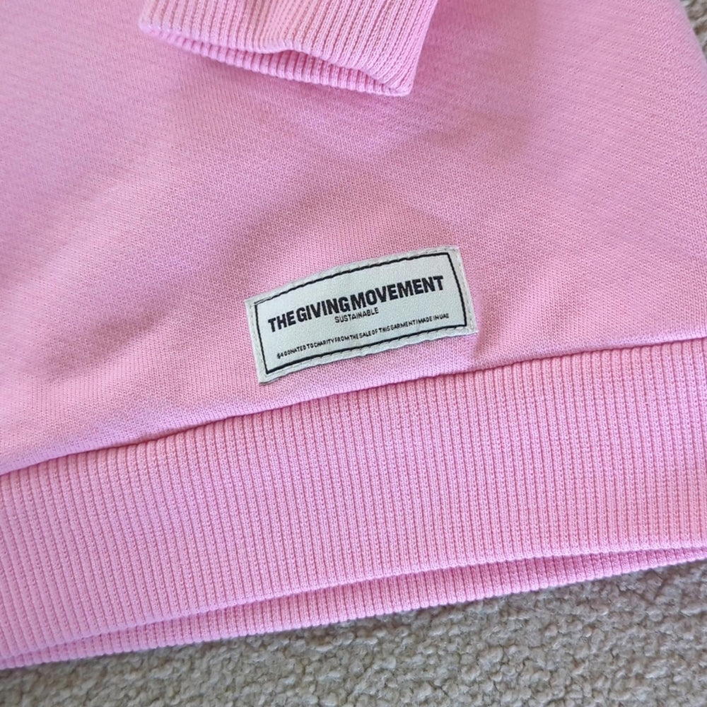 The Giving Movement Pink Logo Patch sweater