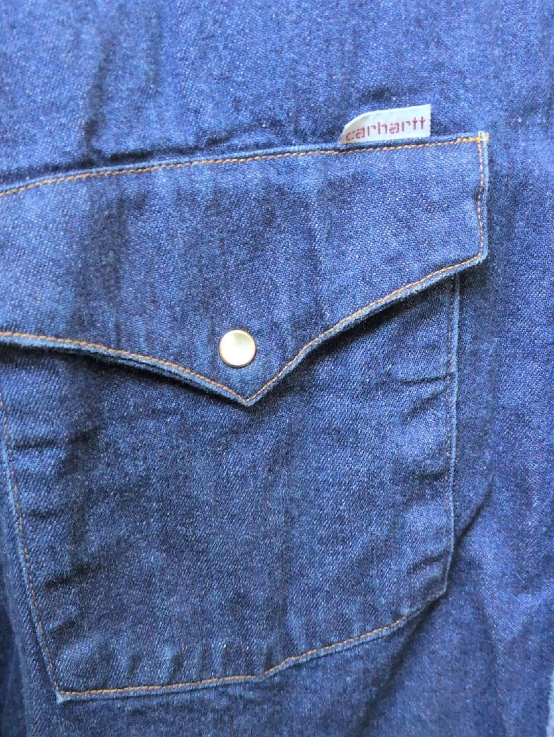 Vintage Carhartt SU008 denim pearl snap shirt In Dark Wash 18 X 36 (XL)