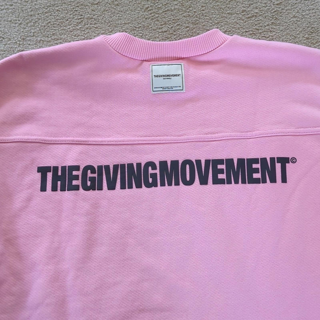 The Giving Movement Pink Logo Patch sweater