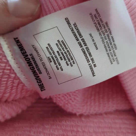 The Giving Movement Pink Logo Patch sweater