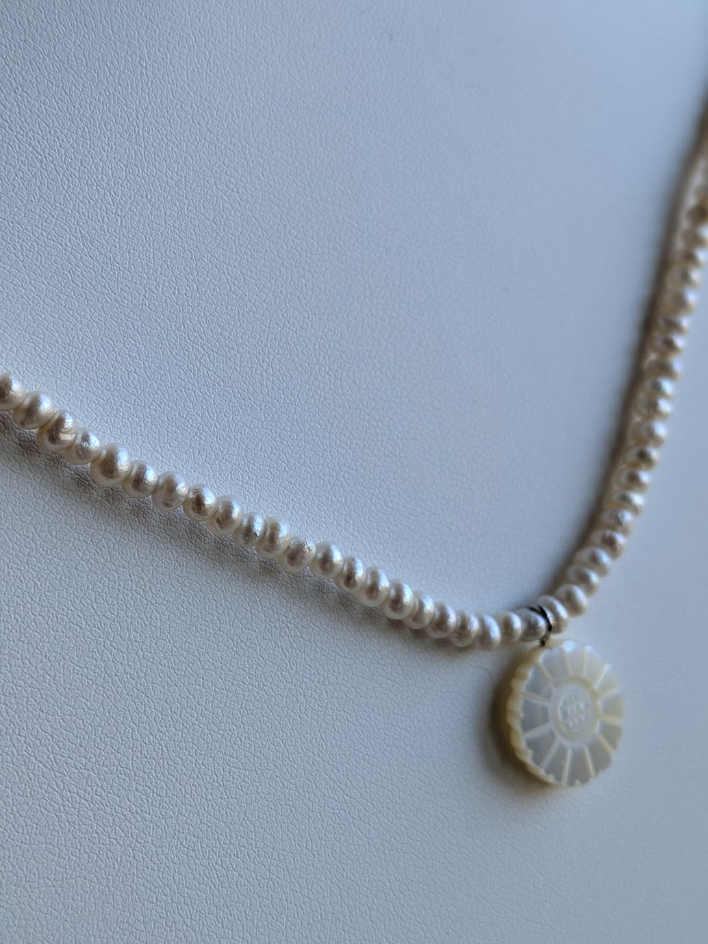 Genuine freshwater pearl strand with hand carved mother-of-pearl flower charm by Sunny Z Jewelry